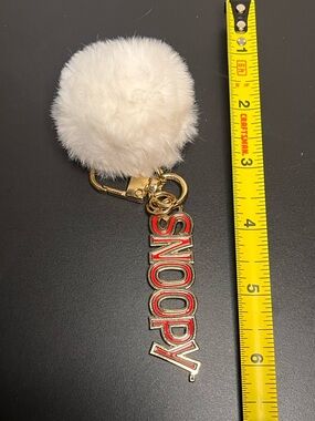 Snoopy gold 'Hoover' Keychain with White Faux Fur Pom